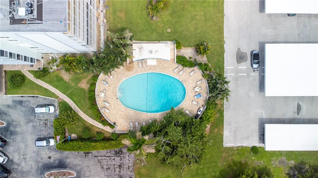 5 Bluebill Avenue, Unit 105 Naples, FL 34108 - Photo 2 of 26 an aerial view of a house with swimming pool and garden