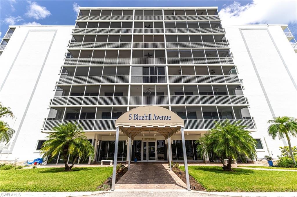 5 Bluebill Avenue, Unit 105 Naples, FL 34108 - Photo 26 of 26 a view of a house with a yard and plants