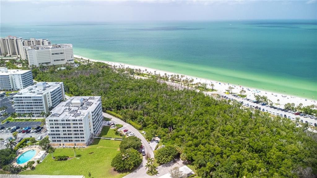 5 Bluebill Avenue, Unit 105 Naples, FL 34108 - Photo 5 of 26 a view of a city and an ocean view