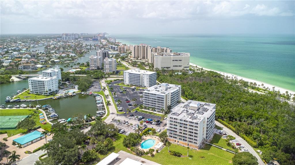 5 Bluebill Avenue, Unit 105 Naples, FL 34108 - Photo 6 of 26 a view of a city from a lake