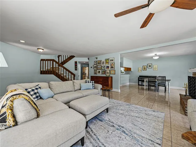 a view of a livingroom with furniture and a window