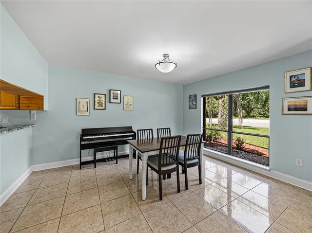 a kitchen with granite countertop a sink and cabinets