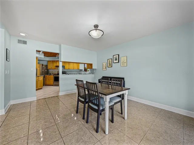a kitchen with a stove sink and cabinets