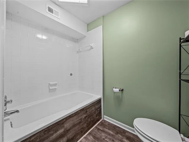 a backyard of a house with green landscape