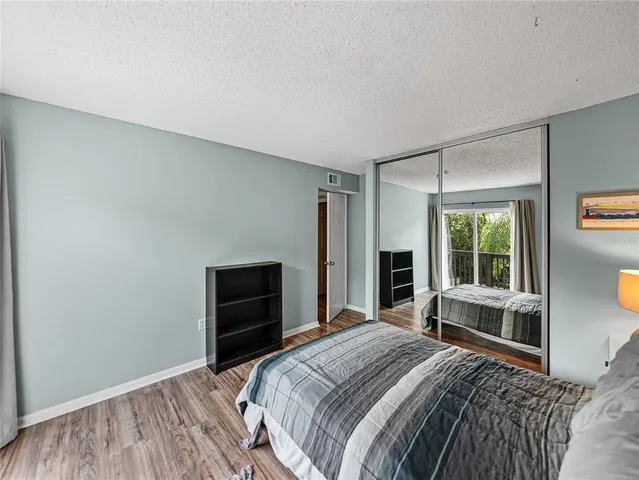 an aerial view of a house with a yard swimming pool and outdoor seating