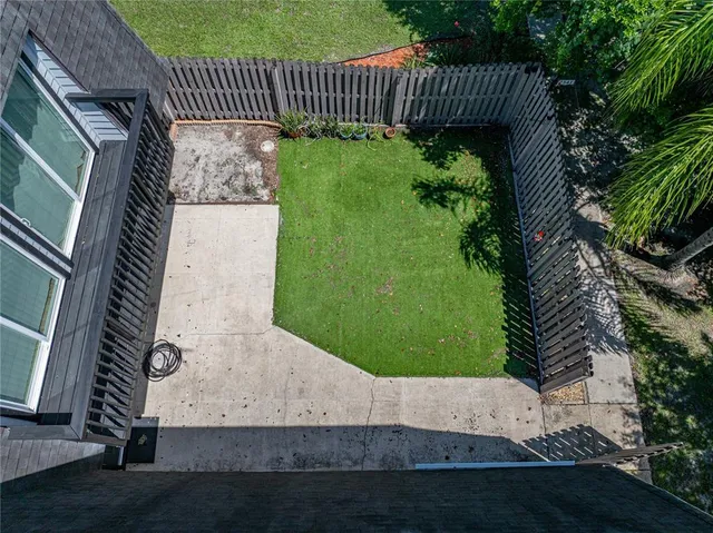 an aerial view of a house with a garden