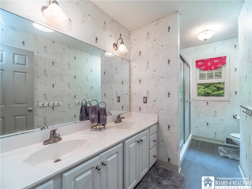 5616 Stow Road North Harmony, NY 14710 - Photo 27 of 37 second floor Bathroom with walk in shower.