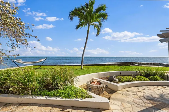 a view of yard with swimming pool and outdoor seating