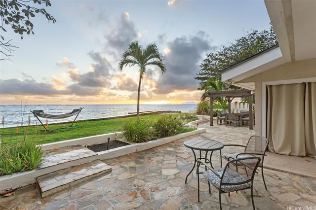 swimming pool with outdoor seating and garden