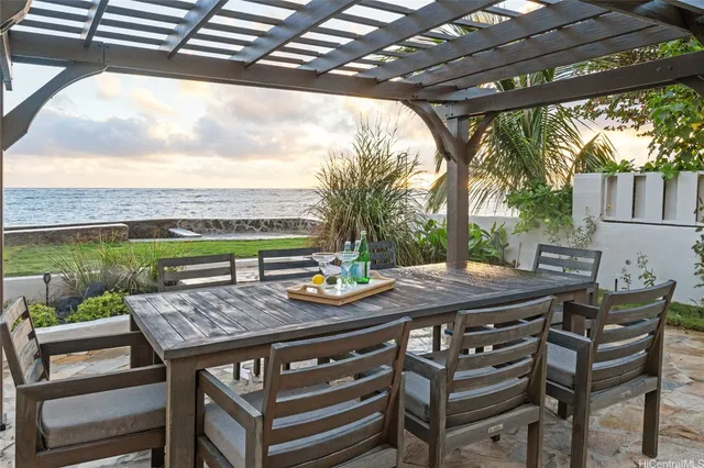 a view of a patio with a table chairs and a table