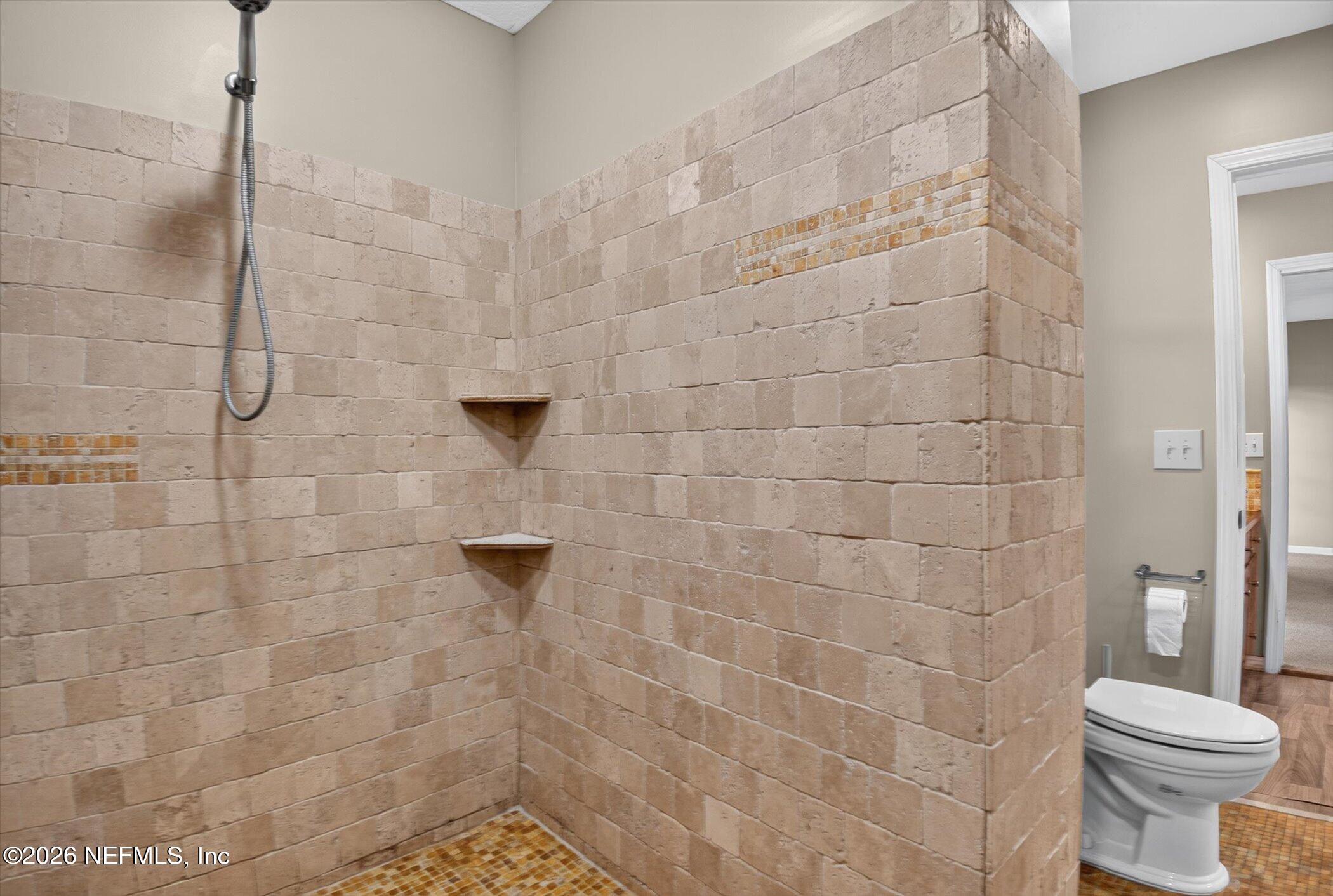 2705 Navajo Road Orange Park, FL 32073 - Photo 43 of 58 a bathroom with a sink a toilet and a shower
