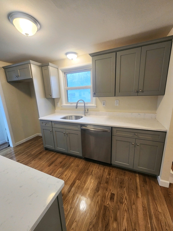 44 Bowes Avenue Quincy, MA 02169 - Photo 7 of 20 a kitchen with stainless steel appliances a sink window and cabinets