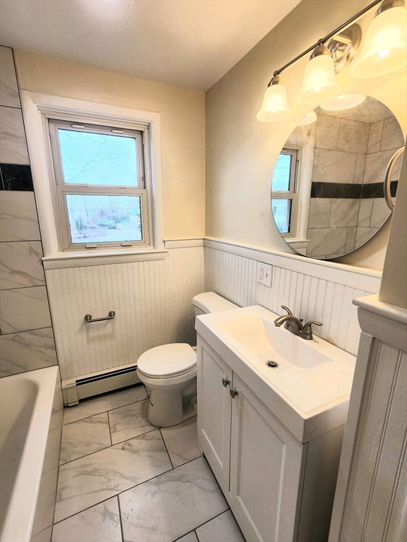 44 Bowes Avenue Quincy, MA 02169 - Photo 9 of 20 a bathroom with a sink and a mirror
