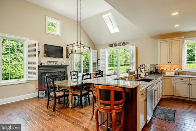a living room with furniture fireplace and flat screen tv