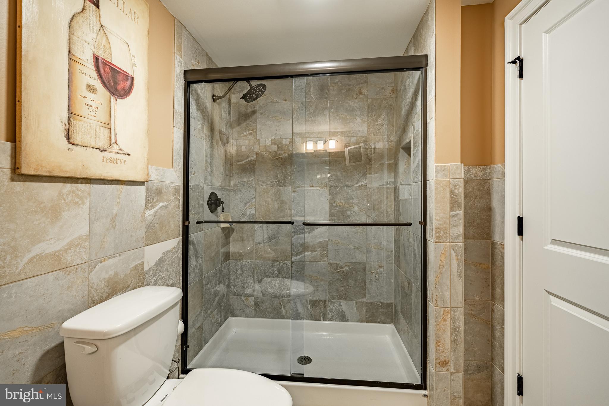 211 Dutton Mill Road West Chester, PA 19380 - Photo 45 of 71 a bathroom with a shower a toilet and a shower