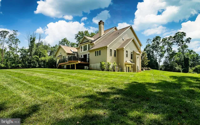 an aerial view of a house with swimming pool