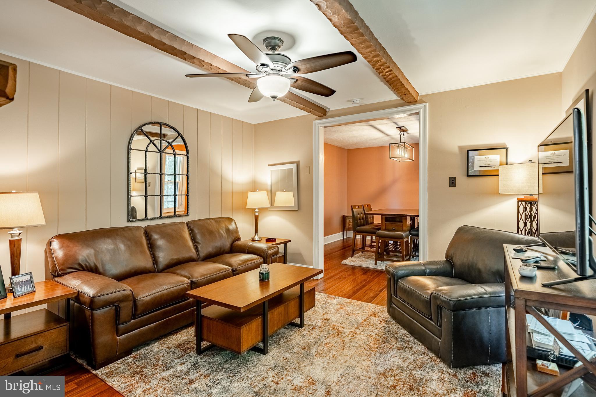 211 Dutton Mill Road West Chester, PA 19380 - Photo 56 of 71 a living room with furniture a ceiling fan and a large window