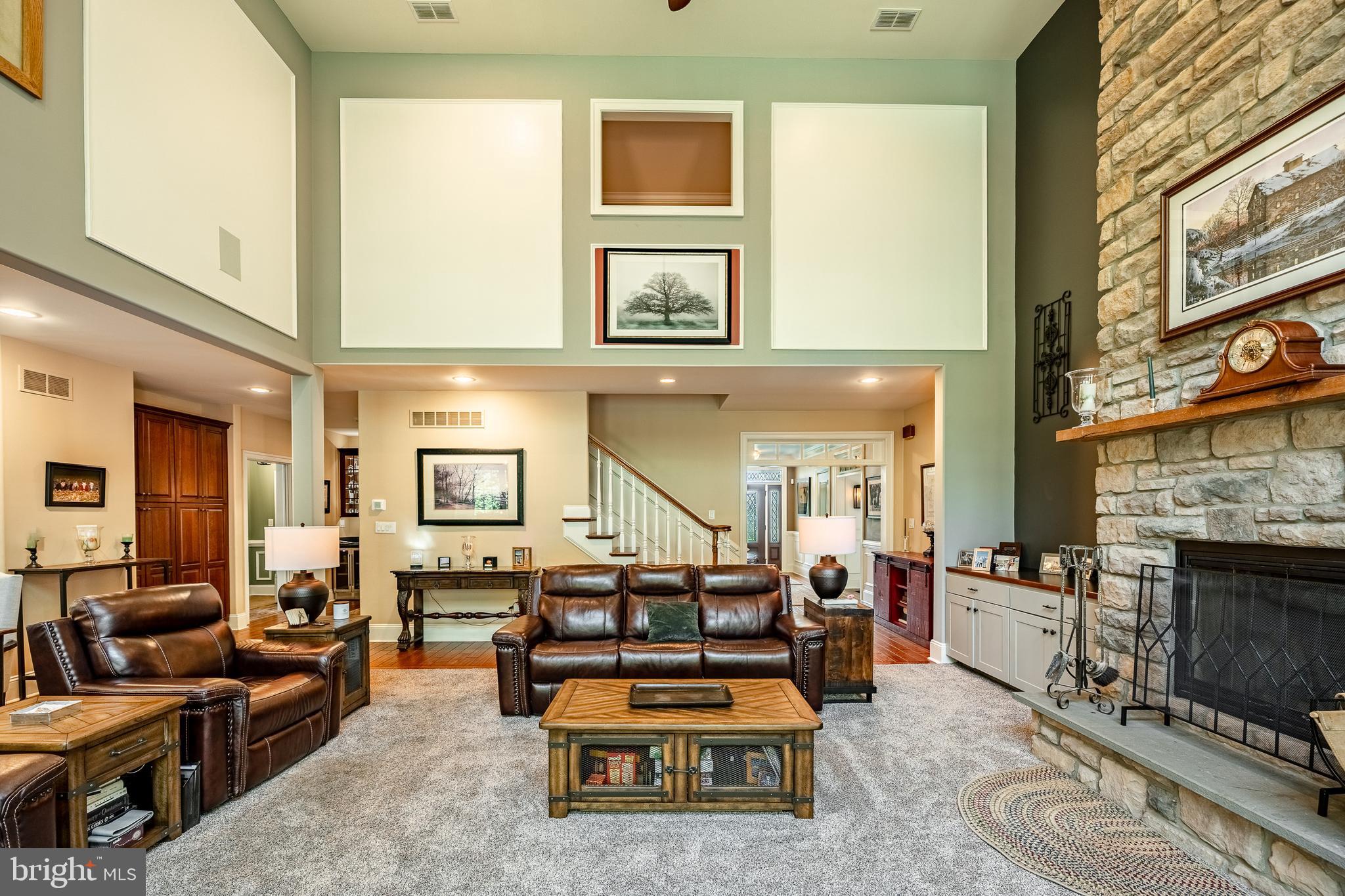 211 Dutton Mill Road West Chester, PA 19380 - Photo 7 of 71 a living room with furniture a fireplace and a large window