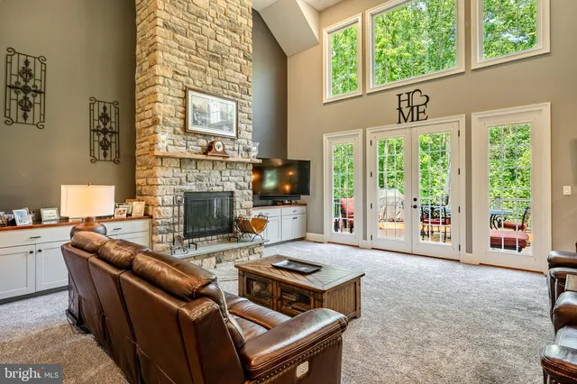 a view of a livingroom with furniture window and wooden floor