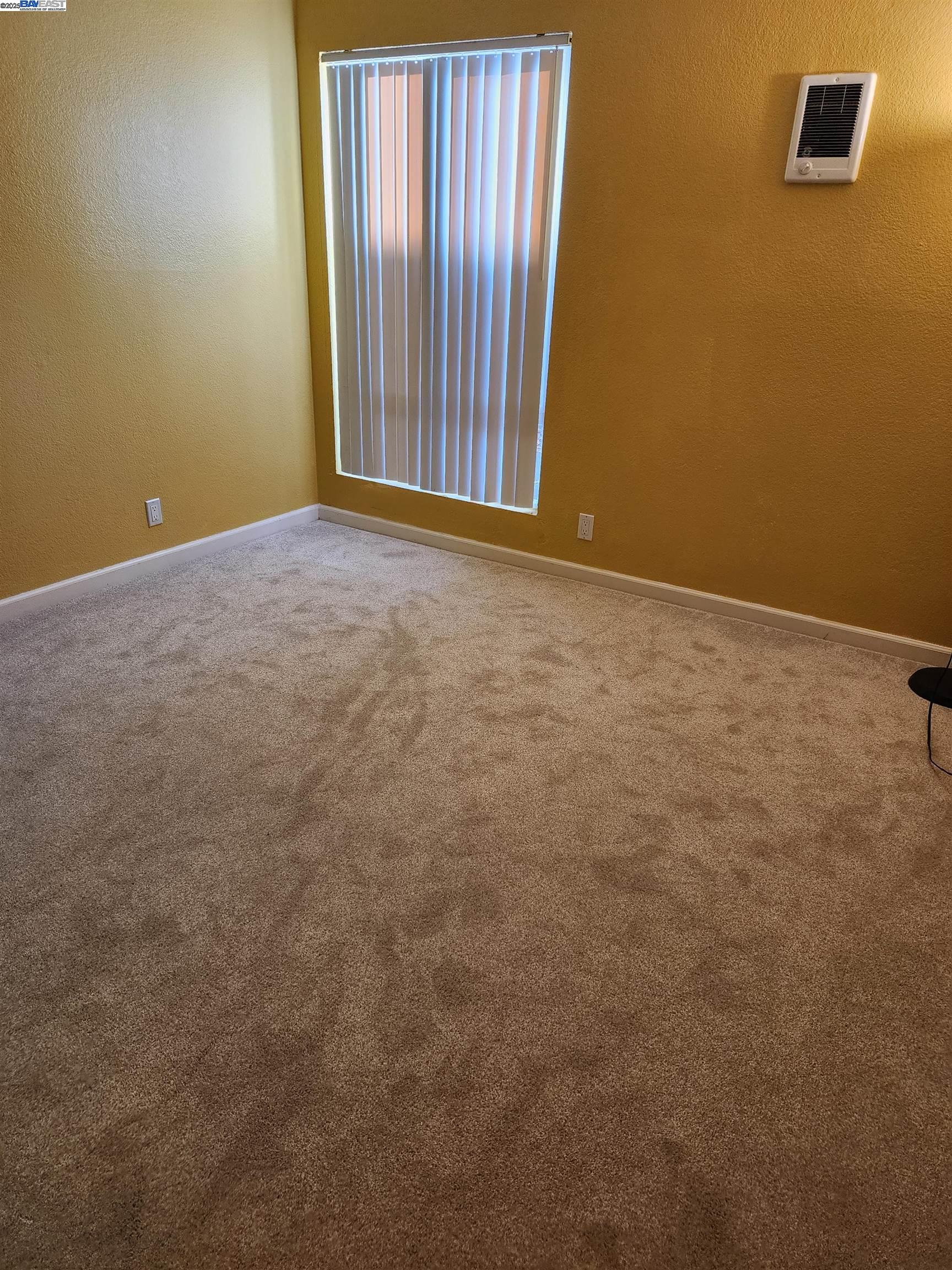 484 Dempsey Road, Unit 186 Milpitas, CA 95035 - Photo 16 of 25 an empty room with windows