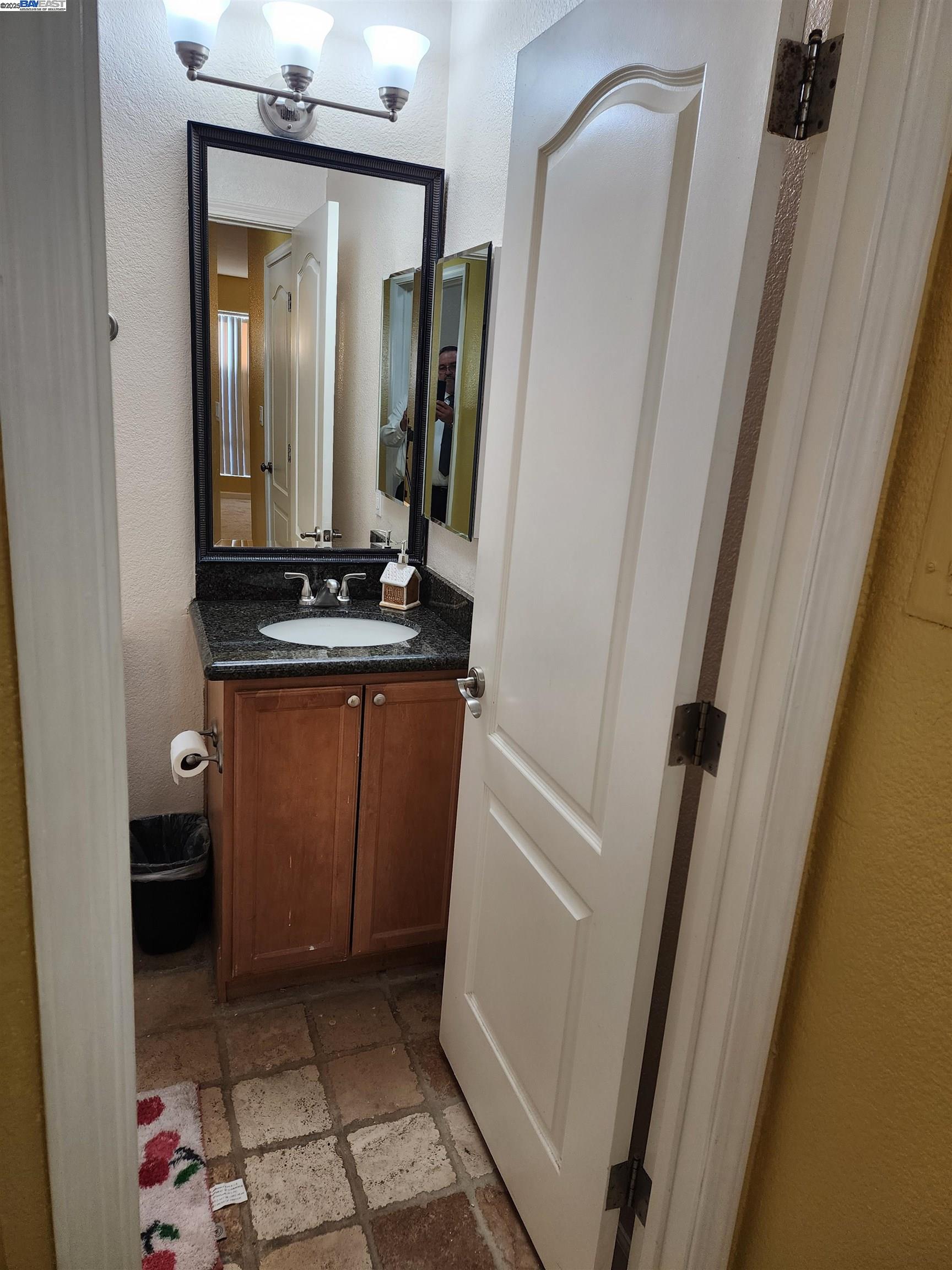 484 Dempsey Road, Unit 186 Milpitas, CA 95035 - Photo 20 of 25 a bathroom with a sink a mirror and vanity