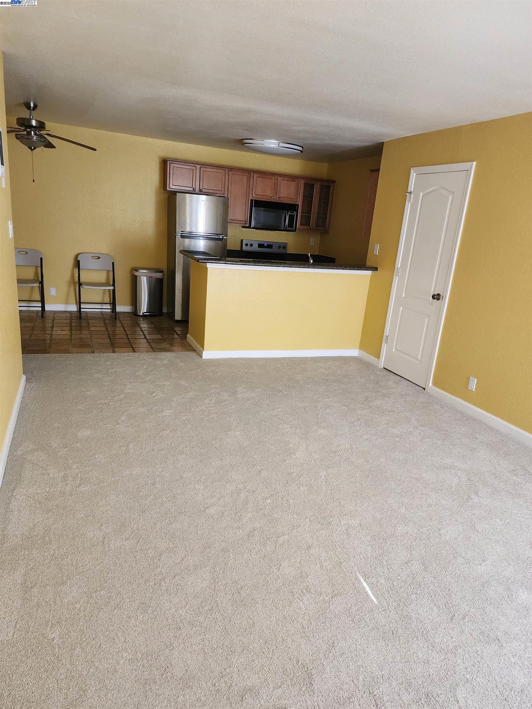 484 Dempsey Road, Unit 186 Milpitas, CA 95035 - Photo 3 of 25 a view of kitchen with furniture and refrigerator