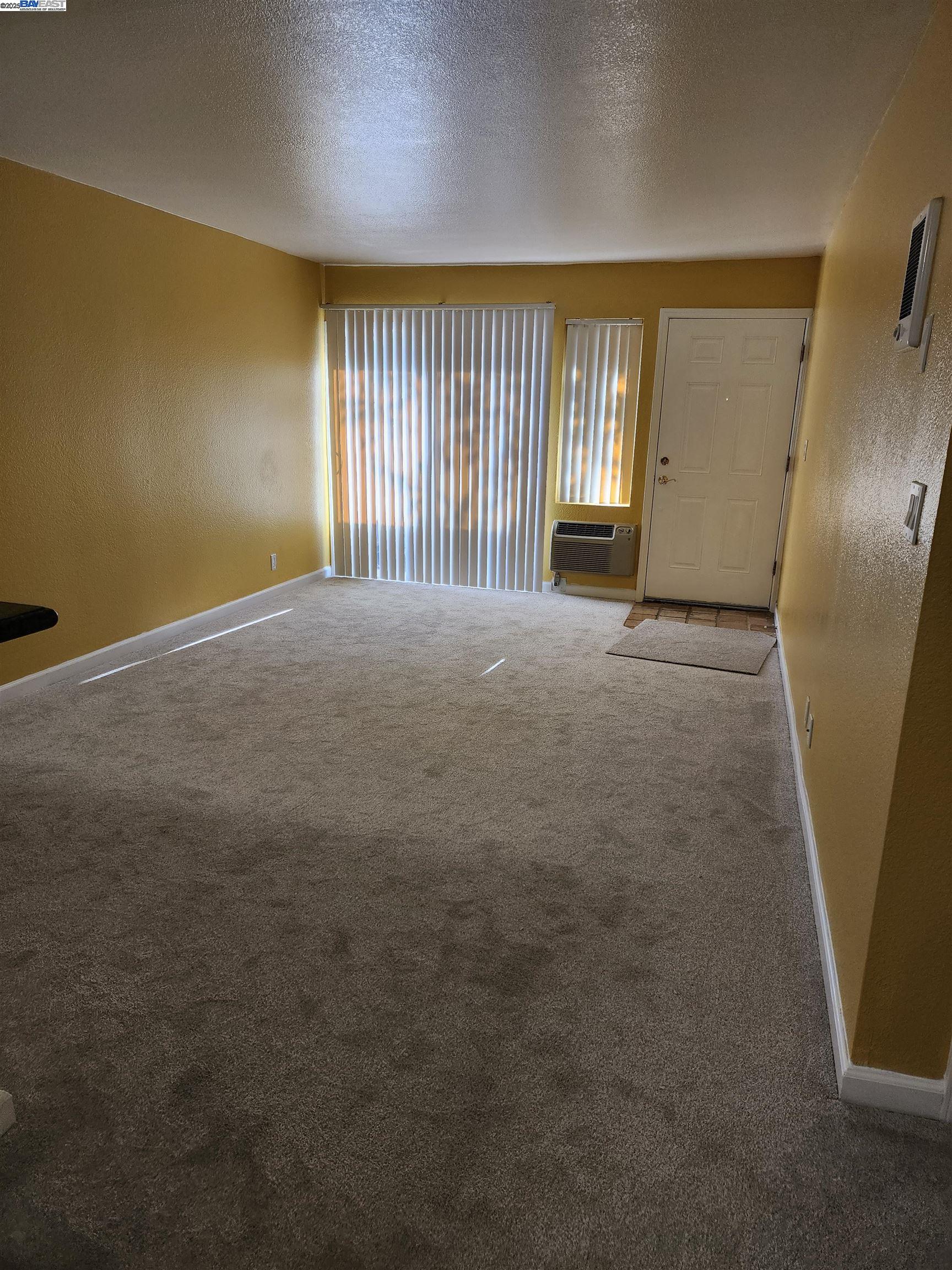 484 Dempsey Road, Unit 186 Milpitas, CA 95035 - Photo 6 of 25 an empty room with windows