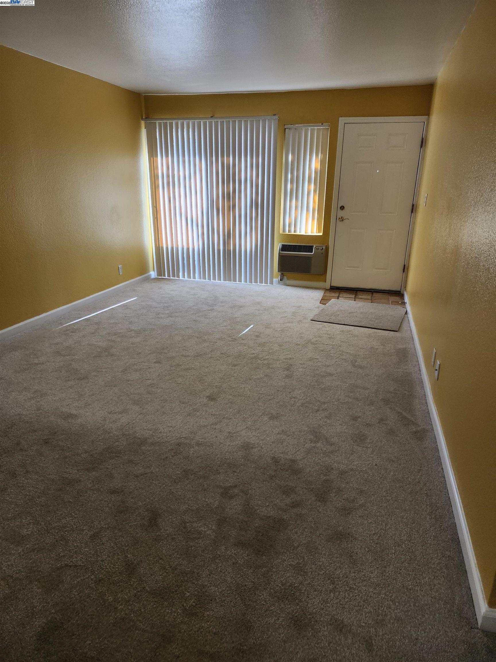 484 Dempsey Road, Unit 186 Milpitas, CA 95035 - Photo 7 of 25 an empty room with windows