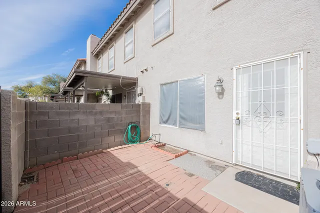 a bedroom with a bed and a mirror