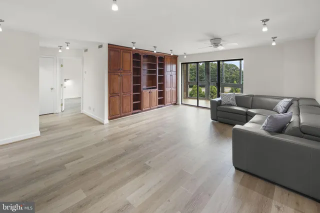 a living room with furniture and large window