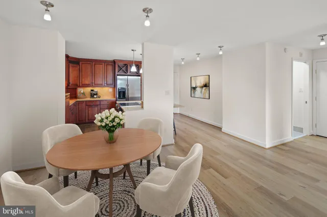 a view of a dining room with furniture and wooden floor