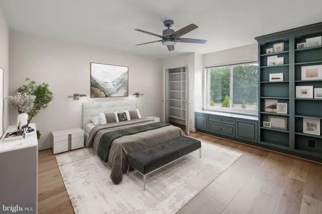 a bedroom with a large bed and a window