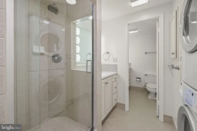 a bathroom with a glass door shower