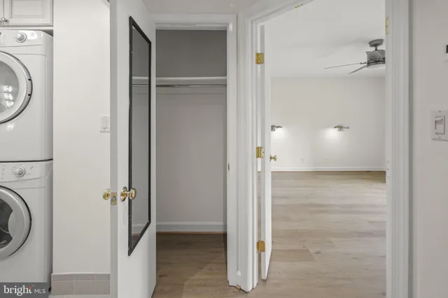 a view of a hallway with washer and dryer