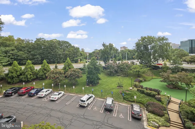 a view of a lake with couches and city view