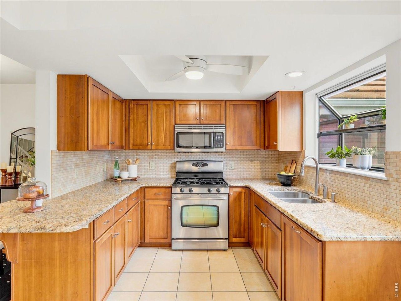 2115 Ranch Drive Denver, CO 80234 - Photo 15 of 50 Stainless appliances and stunning cabinetry
