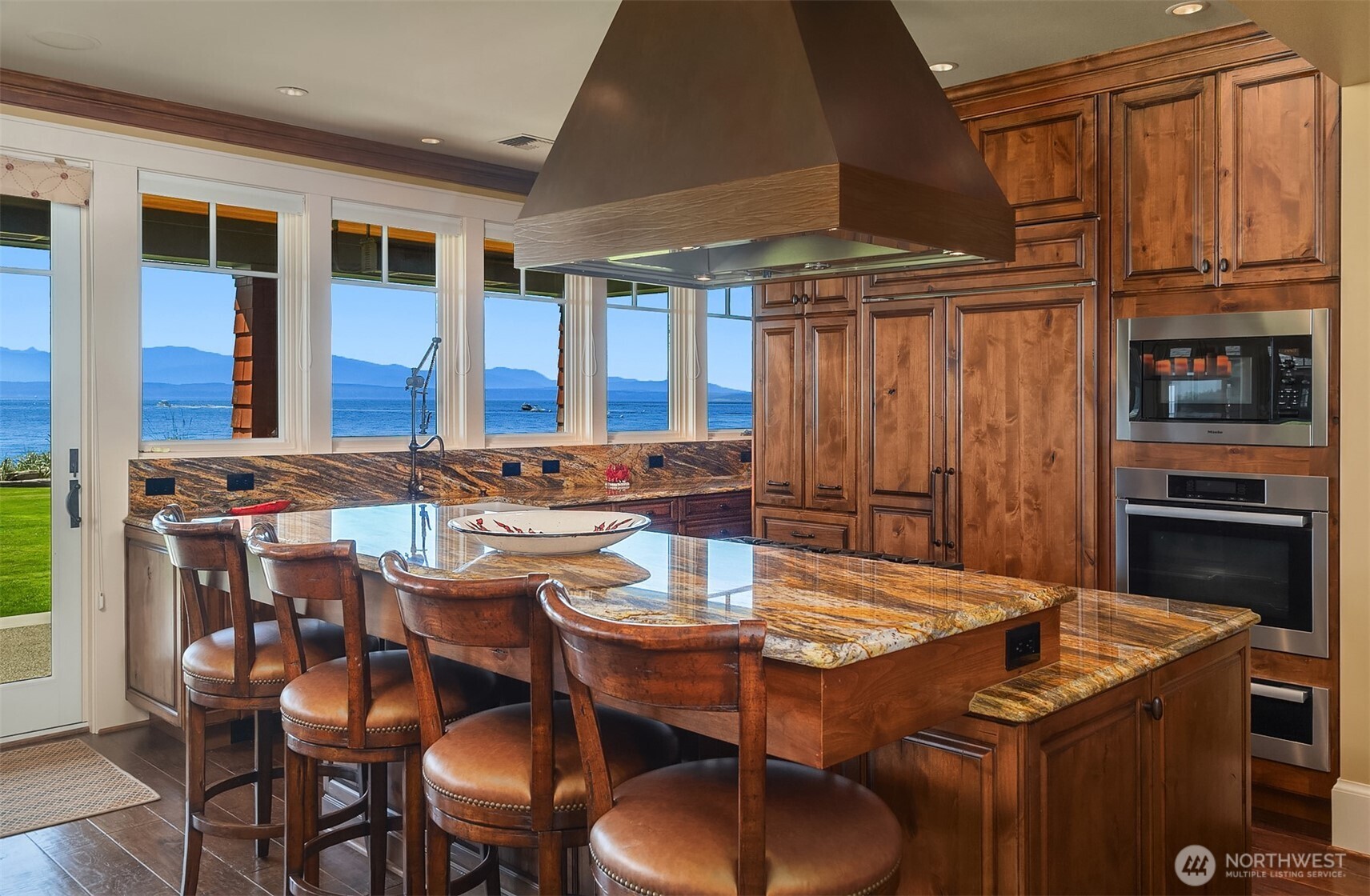 5844 Mutiny Bay Road Freeland, WA 98249 - Photo 13 of 40 a view of a dining room with furniture window and outside view