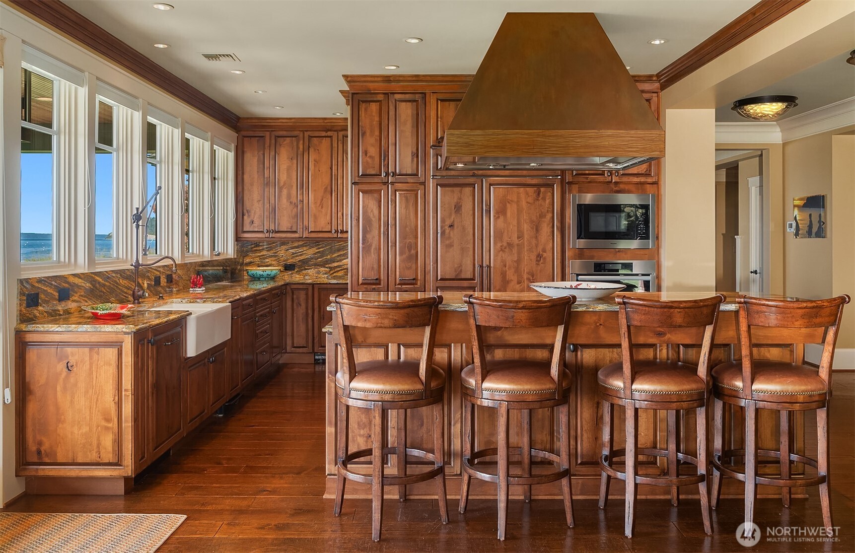 5844 Mutiny Bay Road Freeland, WA 98249 - Photo 14 of 40 a kitchen with stainless steel appliances granite countertop a stove a sink and a refrigerator