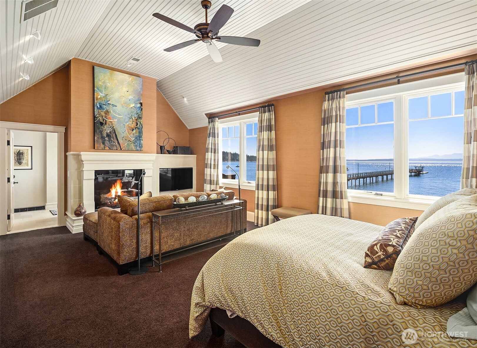 5844 Mutiny Bay Road Freeland, WA 98249 - Photo 23 of 40 a living room with furniture and a fireplace