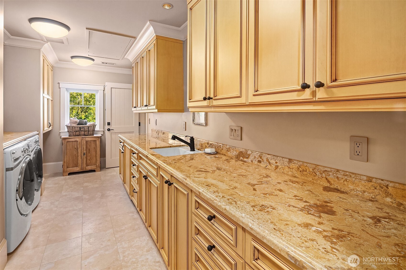 5844 Mutiny Bay Road Freeland, WA 98249 - Photo 31 of 40 a bathroom with a granite countertop sink and a large mirror