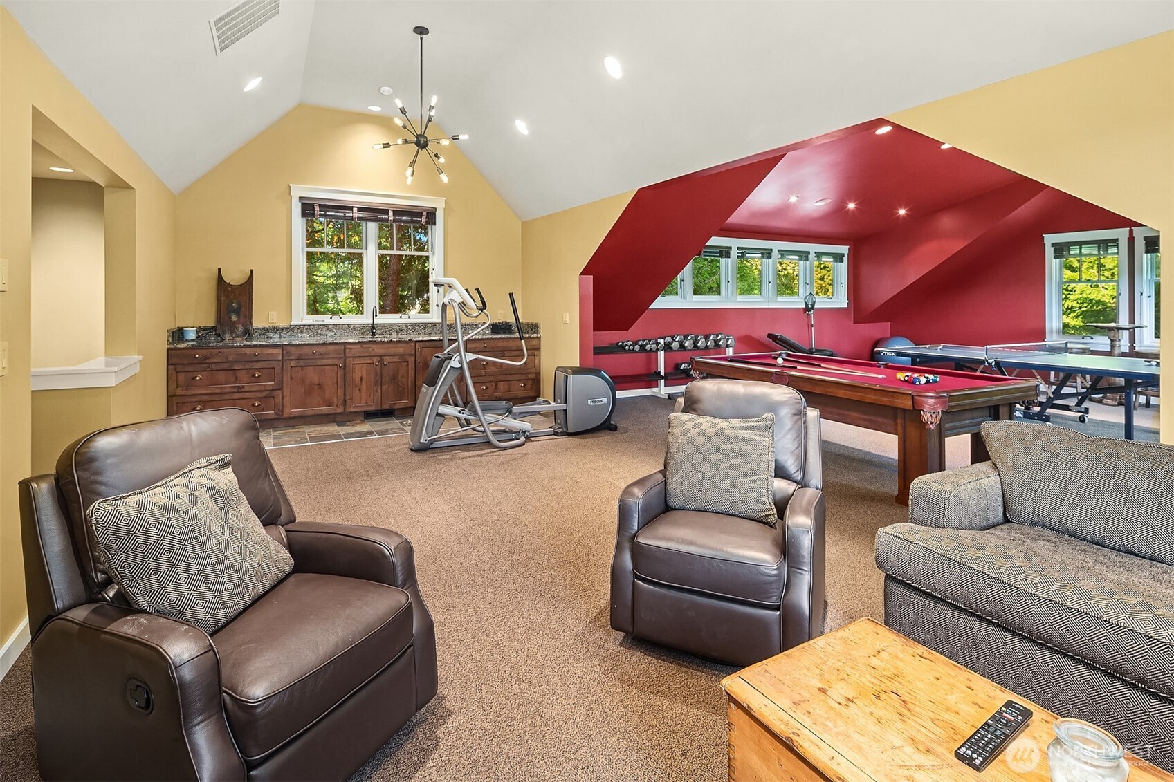 5844 Mutiny Bay Road Freeland, WA 98249 - Photo 32 of 40 a living room with furniture a fireplace and large windows