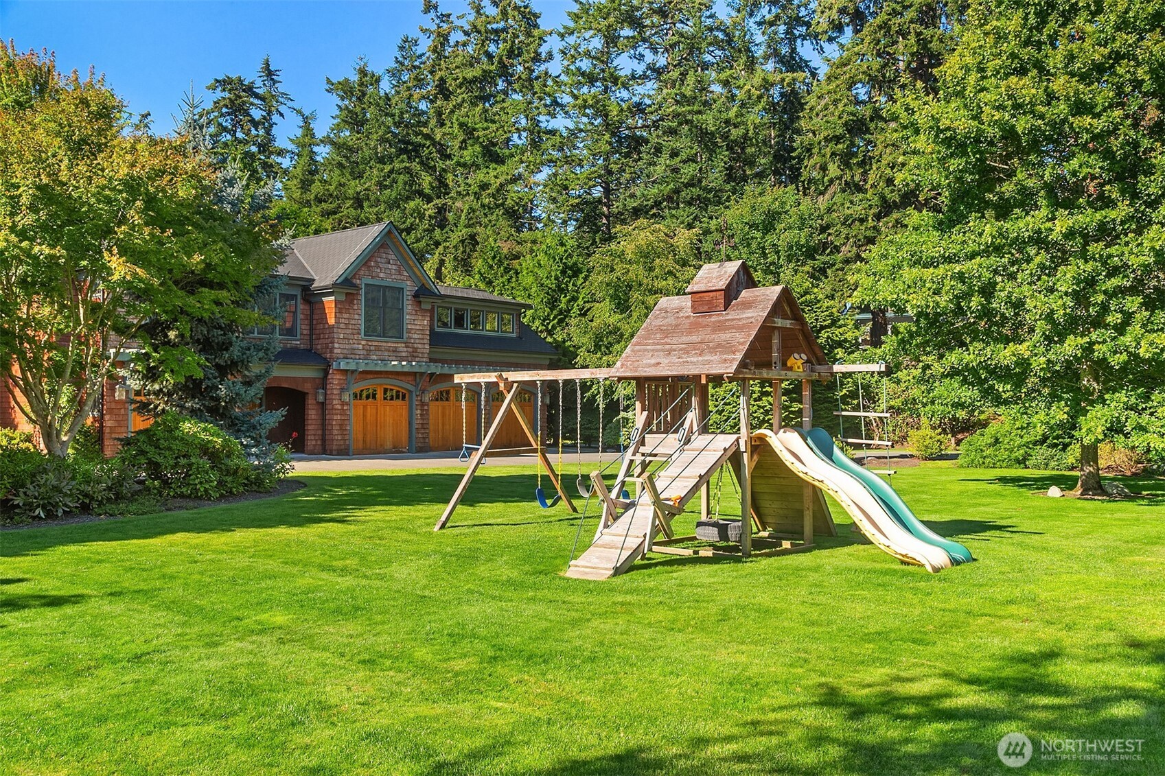 5844 Mutiny Bay Road Freeland, WA 98249 - Photo 36 of 40 a view of a house with a park
