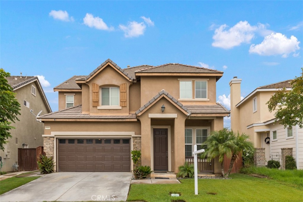 3906 Strand Way Perris, CA 92571 - Photo 1 of 1 a front view of a house with a yard