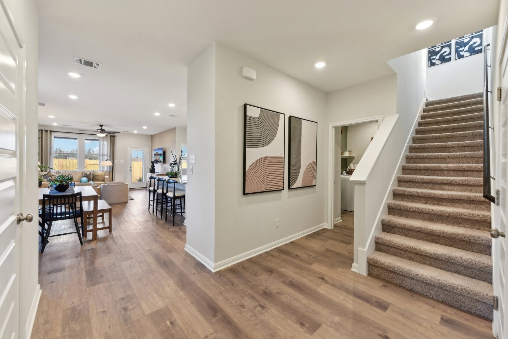253 Firefox Way Jarrell, TX 76537 - Photo 3 of 17 An inviting entry opens to a spacious, well-lit living area featuring rich wood flooring.
