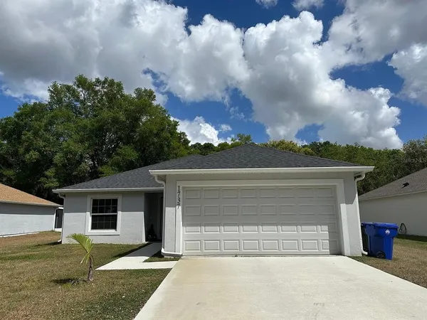 front view of a house with a yard