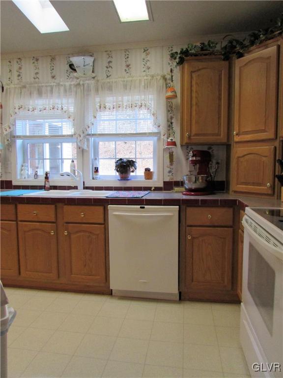 648 Old Mill Road Lehighton, PA 18235 - Photo 21 of 48 a kitchen with stainless steel appliances granite countertop a sink a stove and cabinets