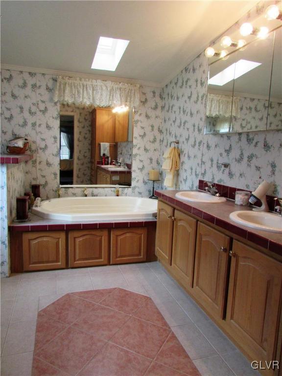 648 Old Mill Road Lehighton, PA 18235 - Photo 31 of 48 a spacious bathroom with a double vanity sink a mirror and a bathtub