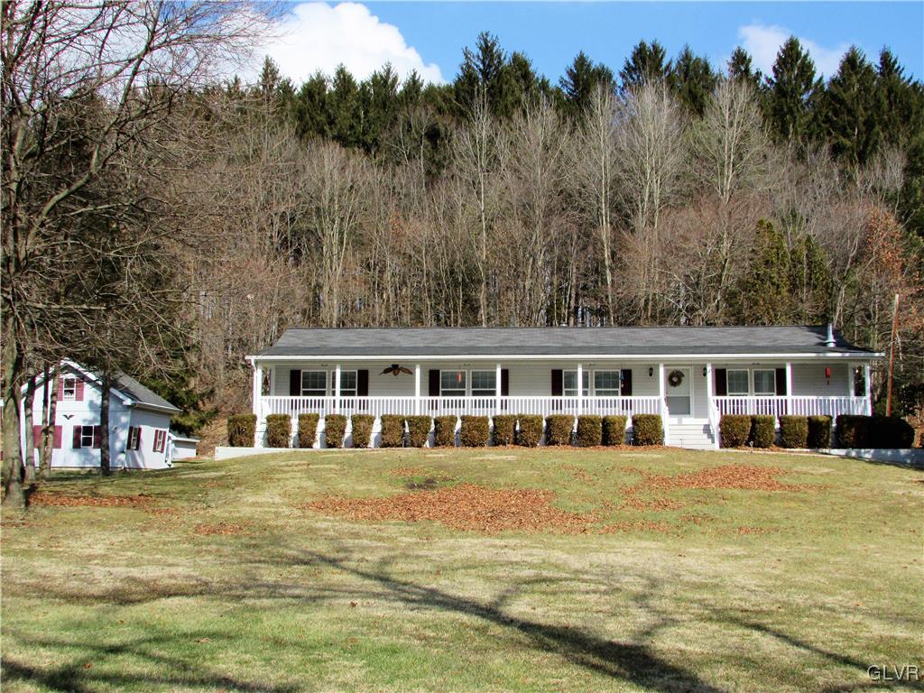 648 Old Mill Road Lehighton, PA 18235 - Photo 4 of 48 a front view of house with yard and trees around