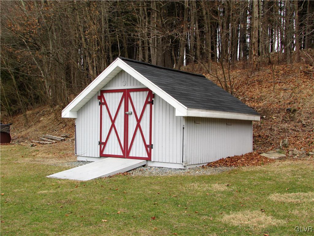 648 Old Mill Road Lehighton, PA 18235 - Photo 45 of 48 a view of wooden house with a yard and fence