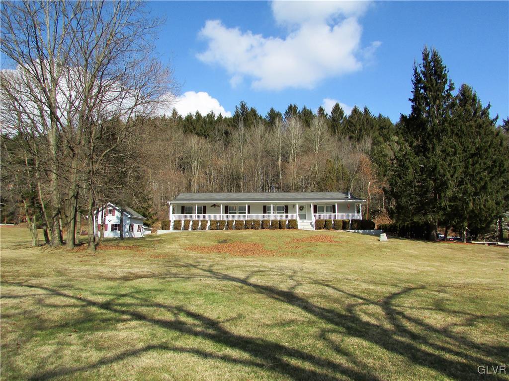 648 Old Mill Road Lehighton, PA 18235 - Photo 5 of 48 a view of a swimming pool with an outdoor space and seating area